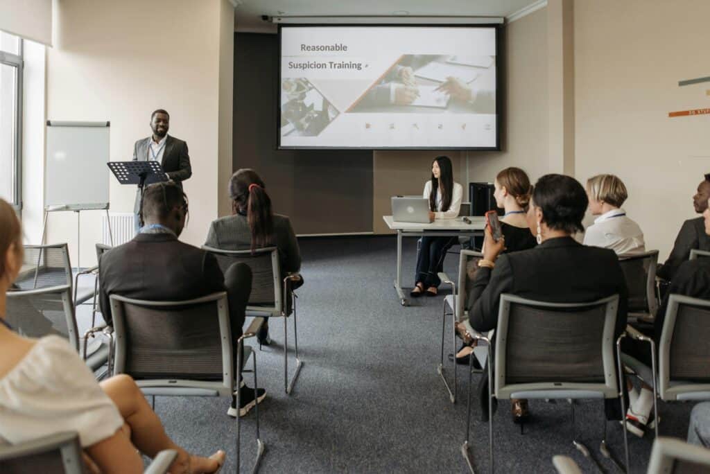 Diverse group of supervisors and employees participating in Substance Use Awareness training.